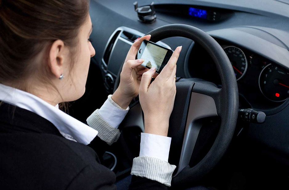 Distracted driving: Half of UK drivers still use their phone at the wheel